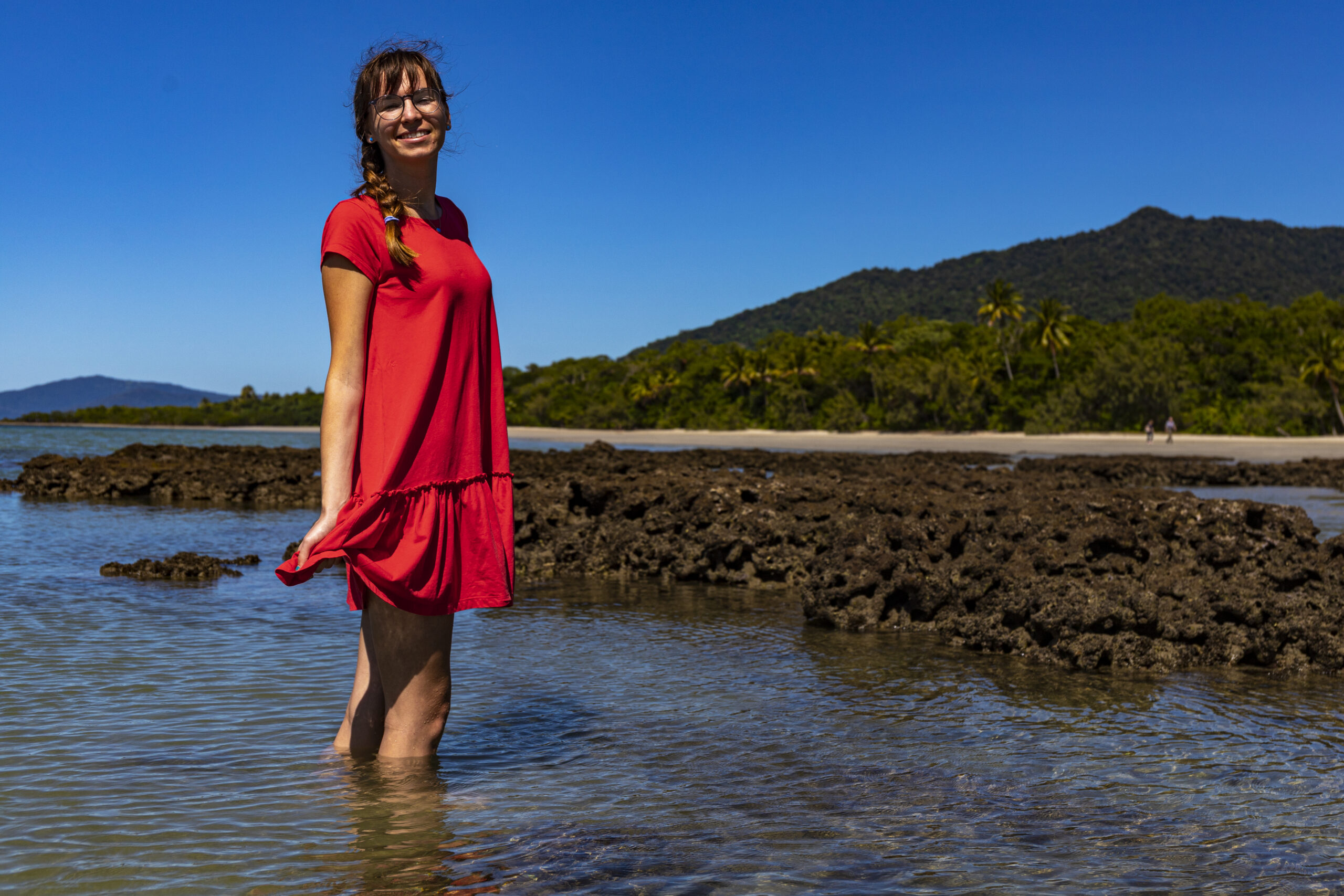 beautiful-girl-red-dress-stands-coral-reef-water-daintree-national-park-australia